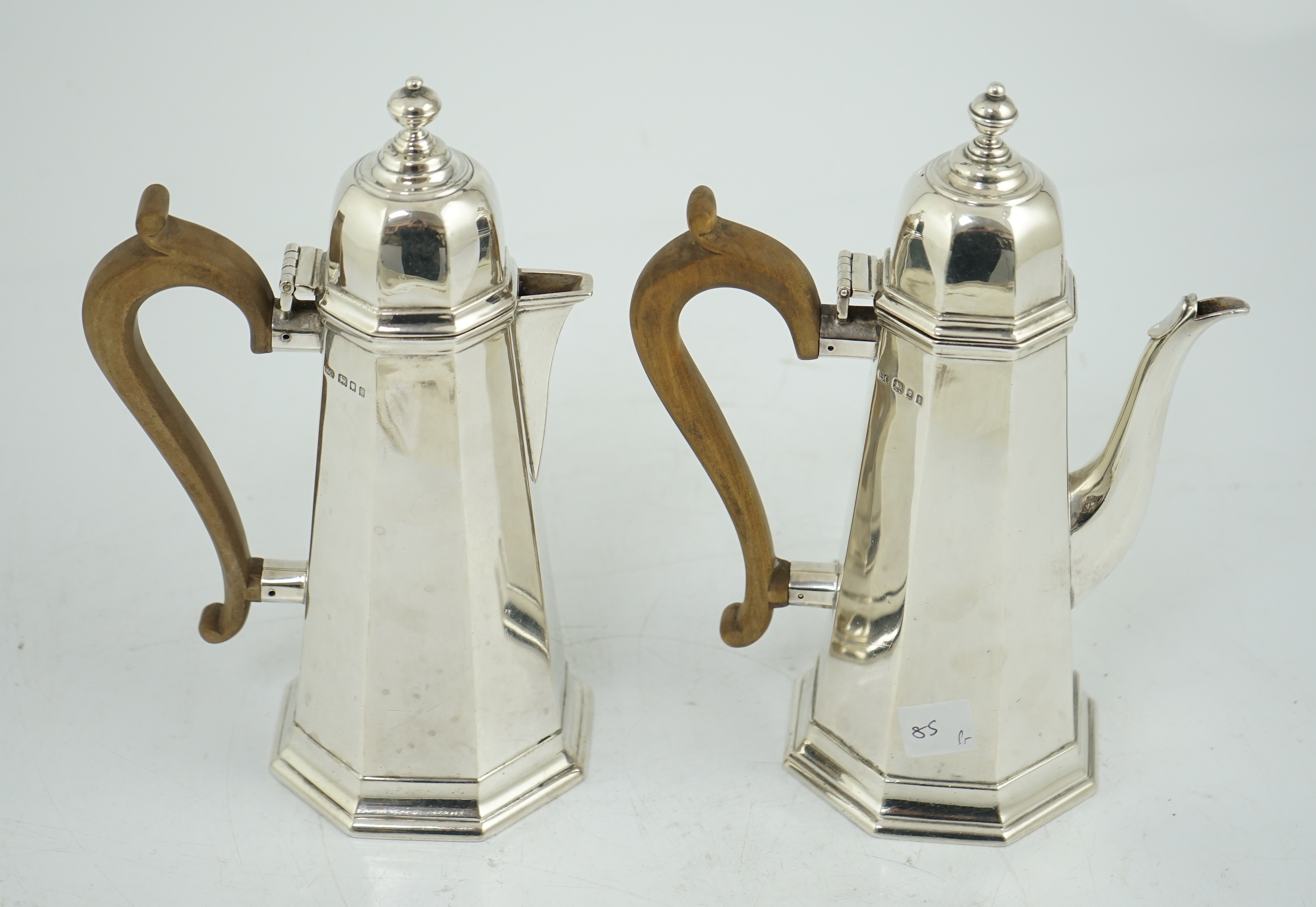 A George V 18th century style silver cafe au lait pair by Garrard & Co